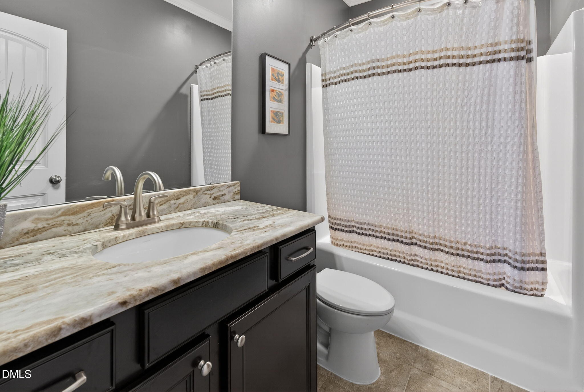 8001 Hergety Drive Raleigh, NC 27603 - Photo 24 of 52 a bathroom with a granite countertop sink toilet and shower