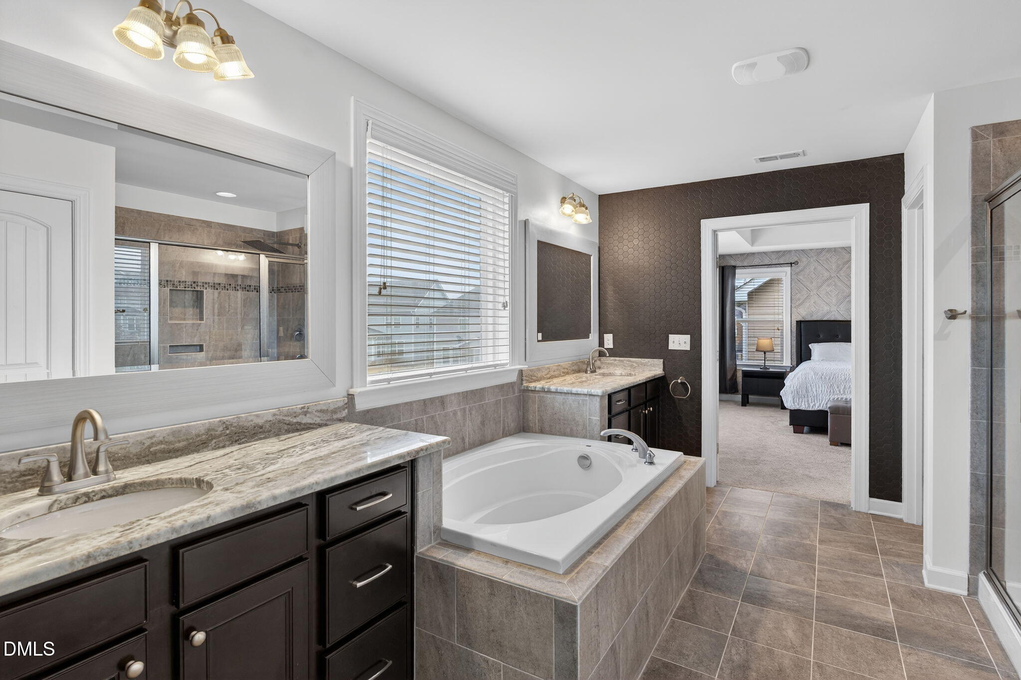 8001 Hergety Drive Raleigh, NC 27603 - Photo 30 of 52 a en suite bathroom with a granite countertop sink and a mirror