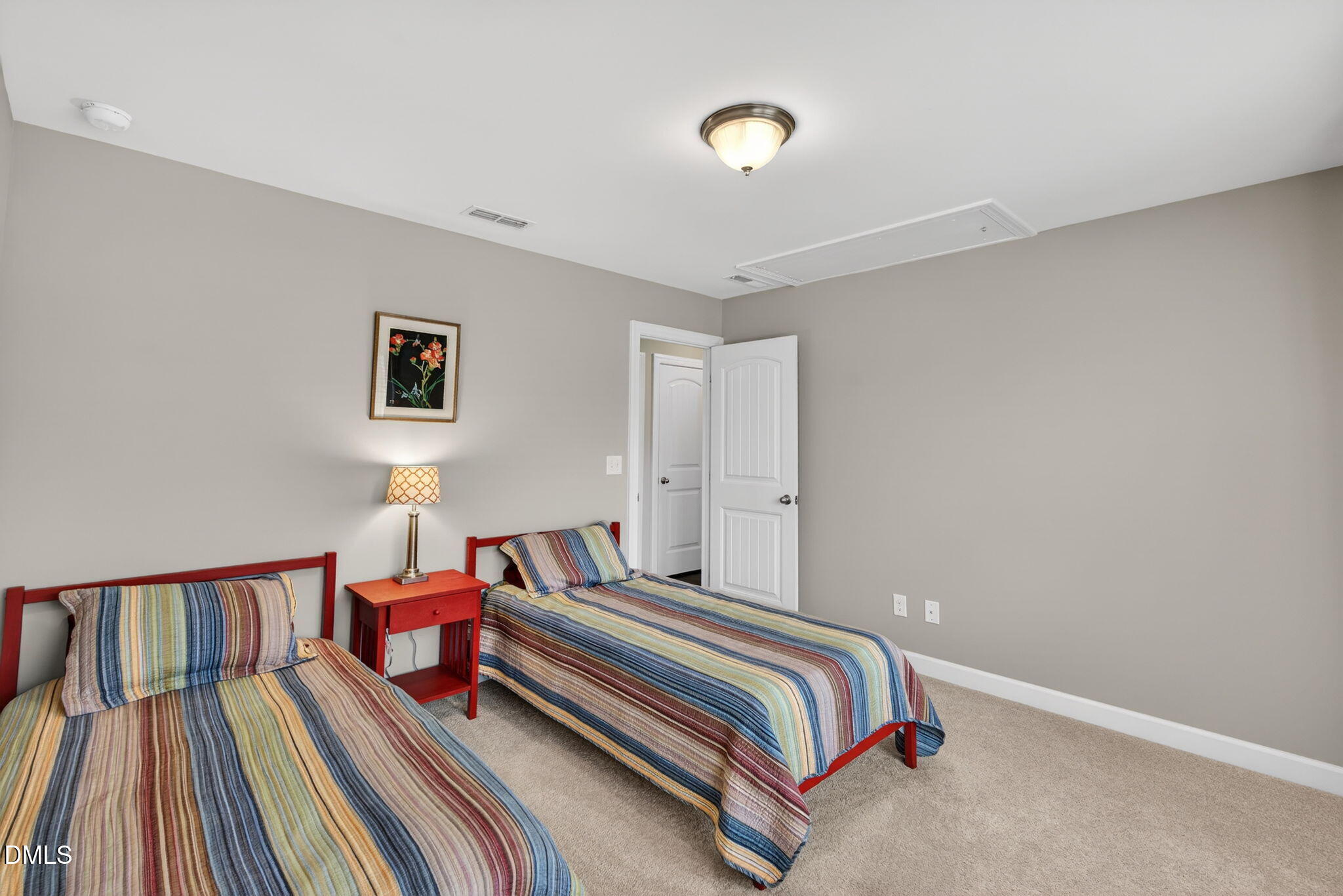 8001 Hergety Drive Raleigh, NC 27603 - Photo 35 of 52 a bedroom with a bed and a lamp