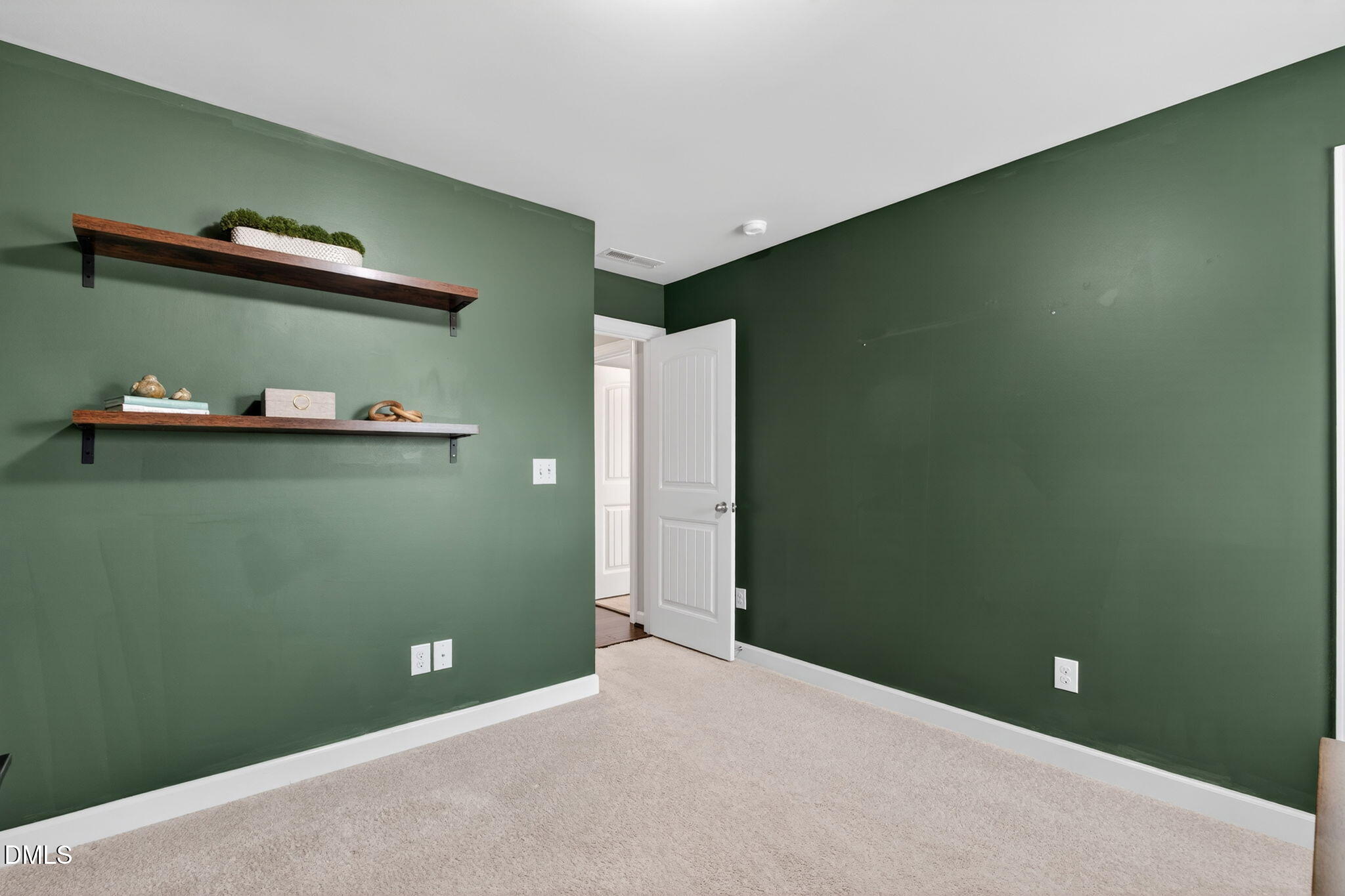 8001 Hergety Drive Raleigh, NC 27603 - Photo 37 of 52 a view of a room with rack on the wall