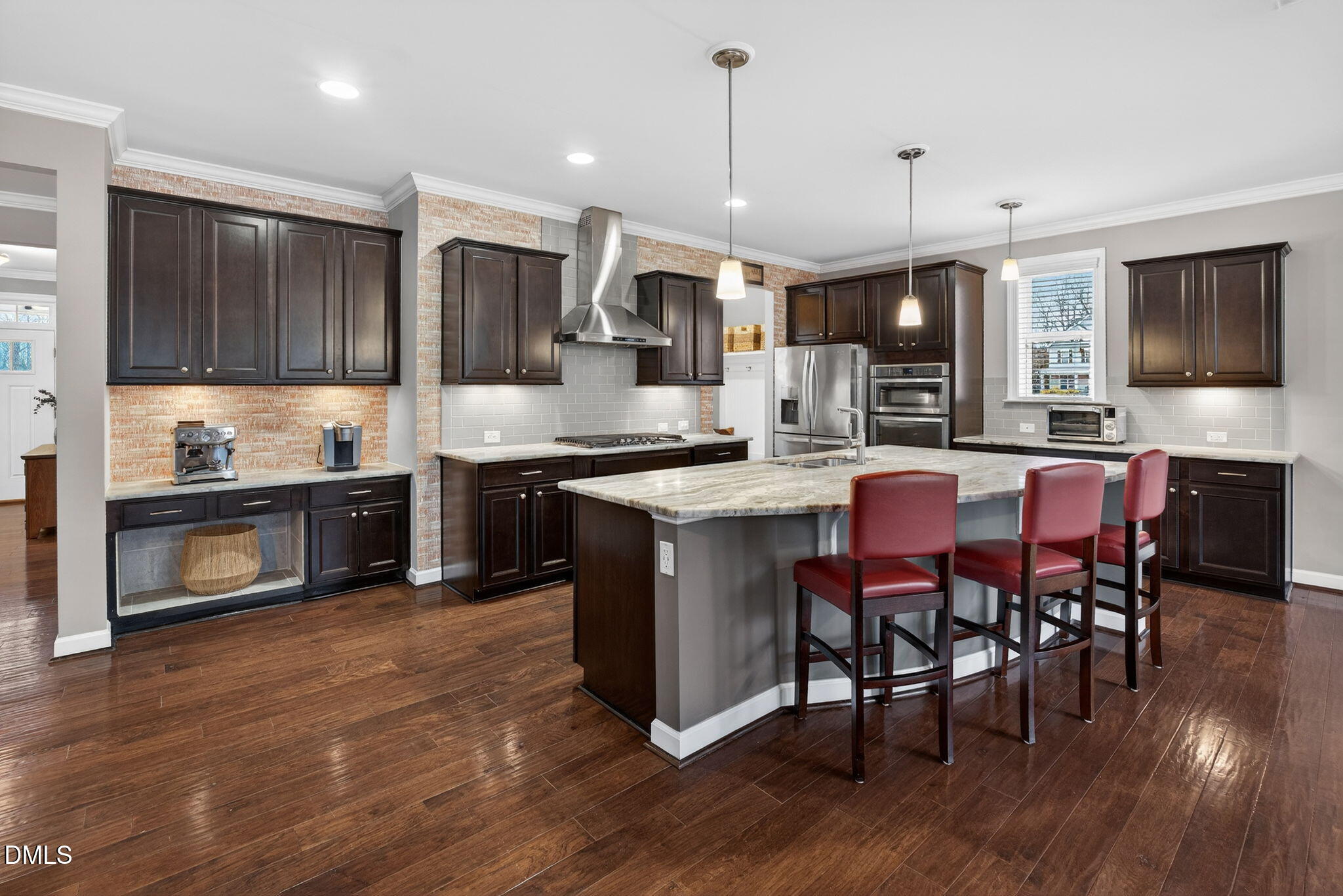 8001 Hergety Drive Raleigh, NC 27603 - Photo 4 of 52 a kitchen with stainless steel appliances granite countertop a stove a sink a microwave a center island and a cabinets