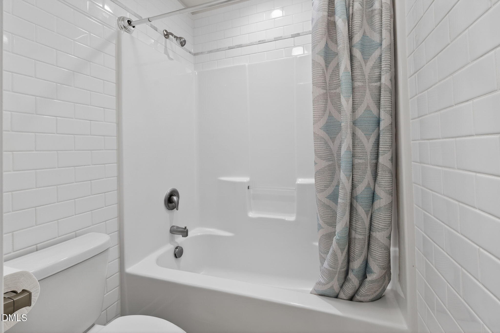 8001 Hergety Drive Raleigh, NC 27603 - Photo 41 of 52 a bathroom with a shower and a bath tub