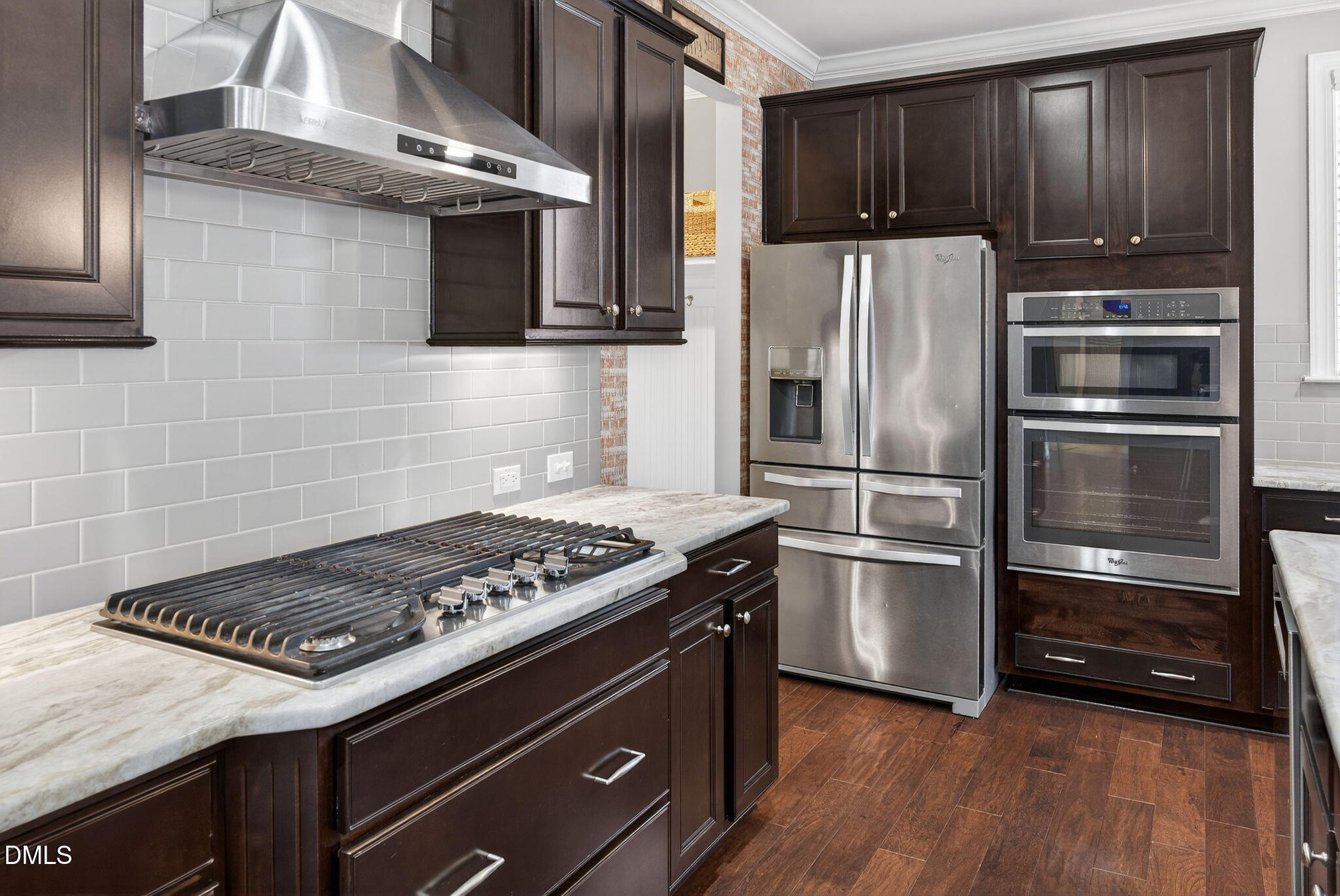 8001 Hergety Drive Raleigh, NC 27603 - Photo 10 of 52 a kitchen with granite countertop stainless steel appliances and wooden cabinets