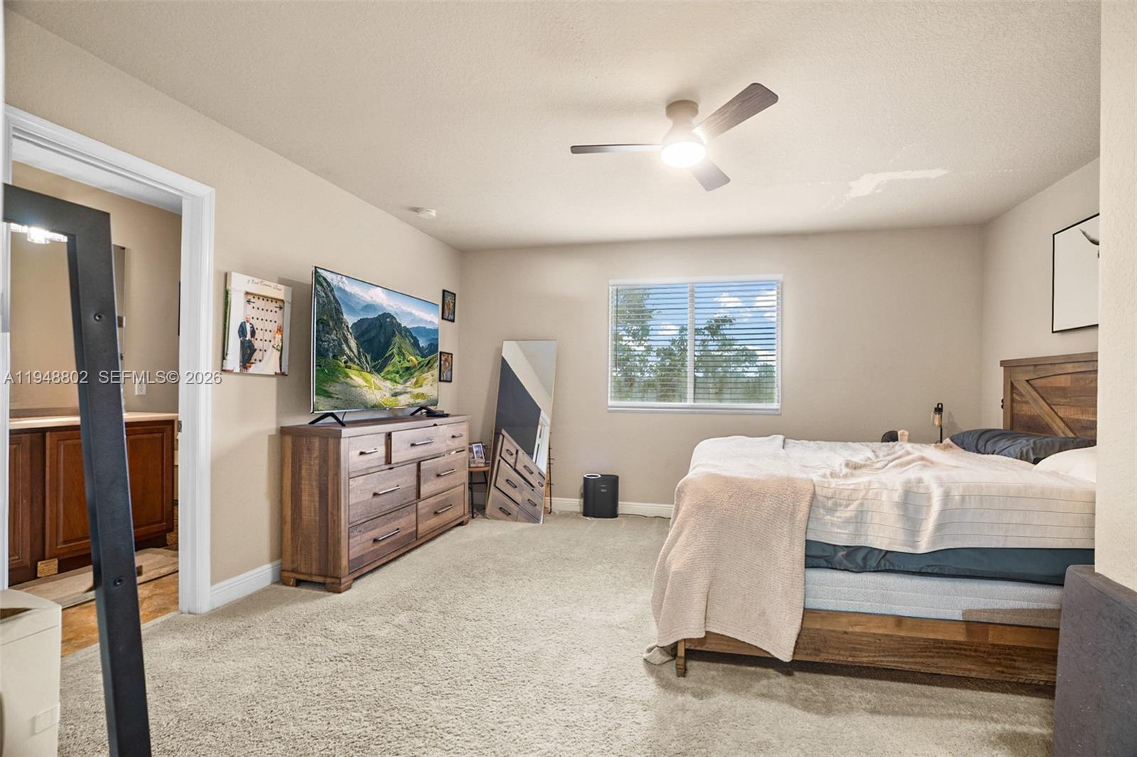 5951 Royal Way Tamarac, FL 33321 - Photo 11 of 33 a bedroom with a bed and a window