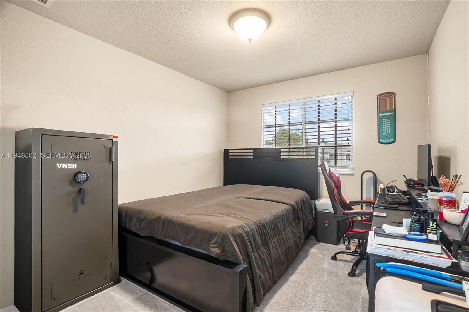 5951 Royal Way Tamarac, FL 33321 - Photo 16 of 33 a bedroom with a bed and wooden floor