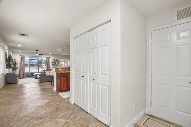 a view of a livingroom with furniture and a window