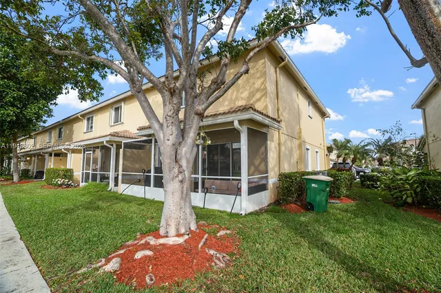 a view of a yard in front of house with a yard