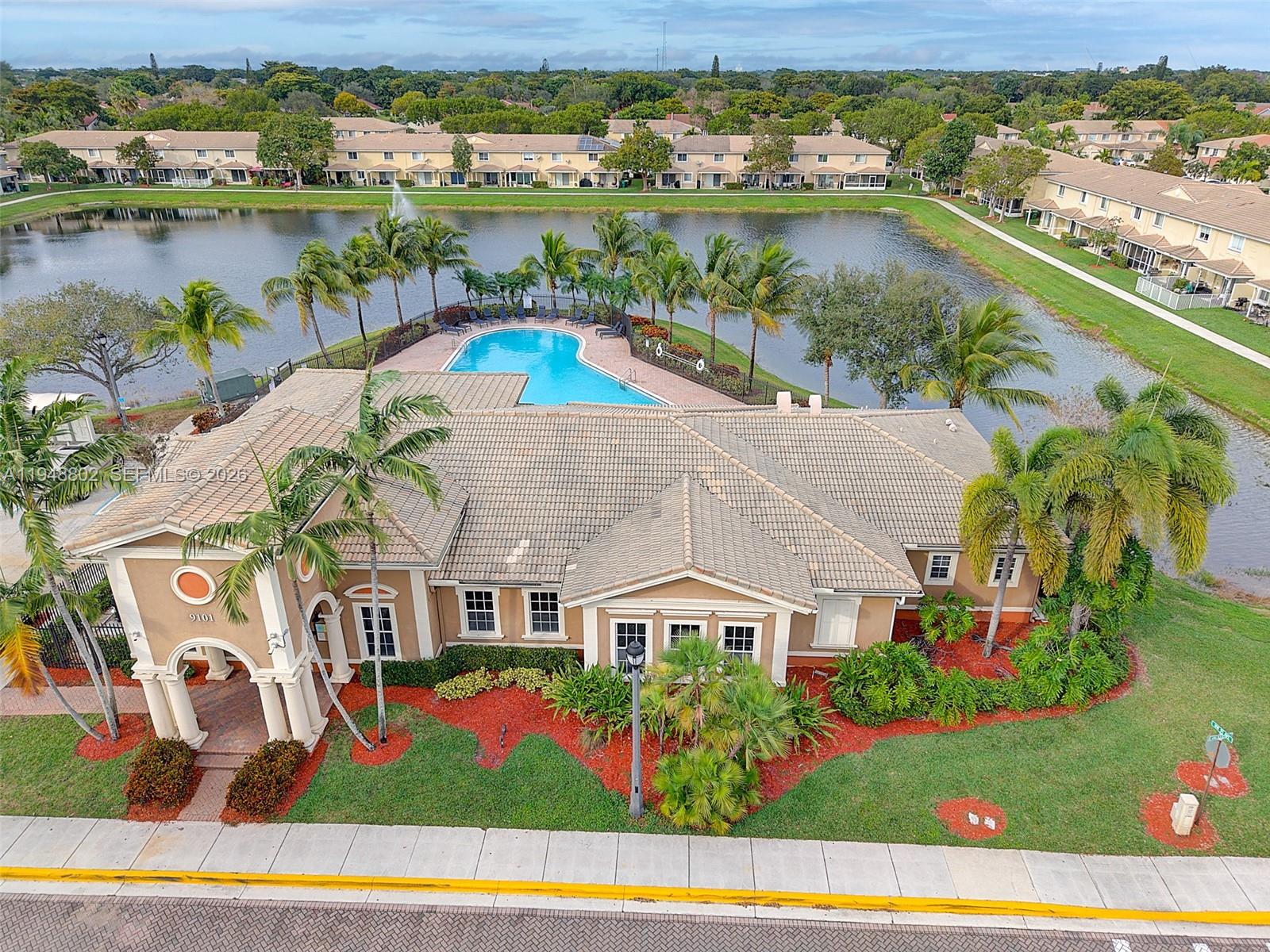 5951 Royal Way Tamarac, FL 33321 - Photo 29 of 33 an aerial view of residential houses with outdoor space and lake view