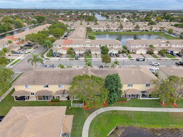 an aerial view of a house with a lake view
