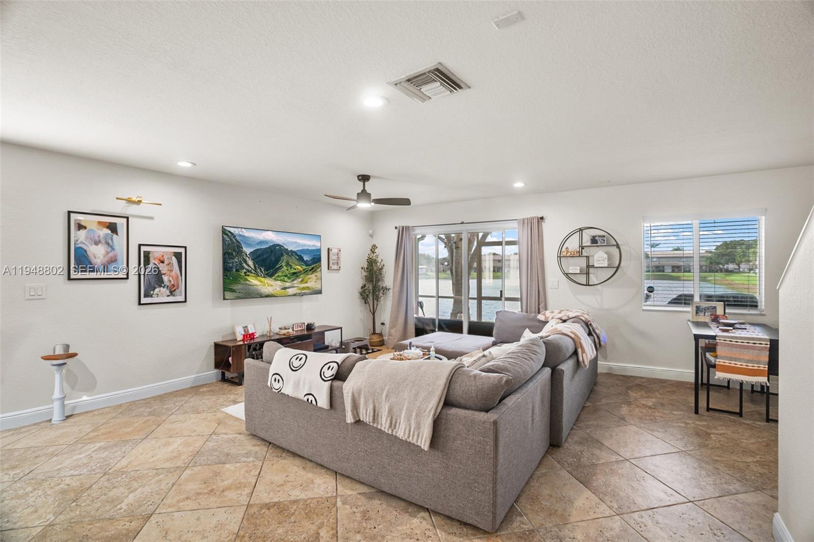 5951 Royal Way Tamarac, FL 33321 - Photo 7 of 33 a living room with furniture and a large window