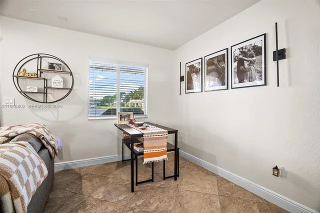 a room with a table and a window