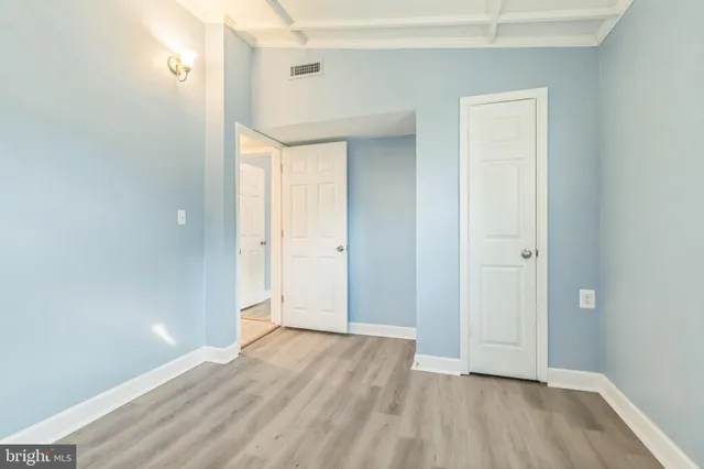 a view of a backyard with plants and a garden
