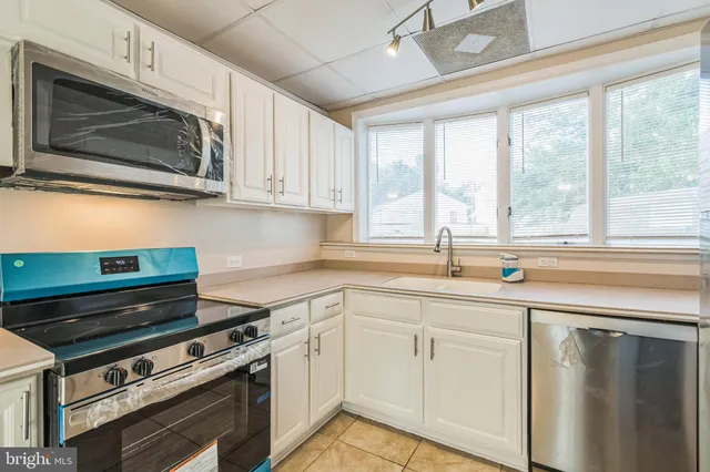 a view of a backyard with sitting area