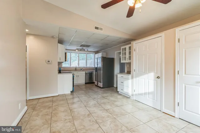 a view of a backyard with sitting area