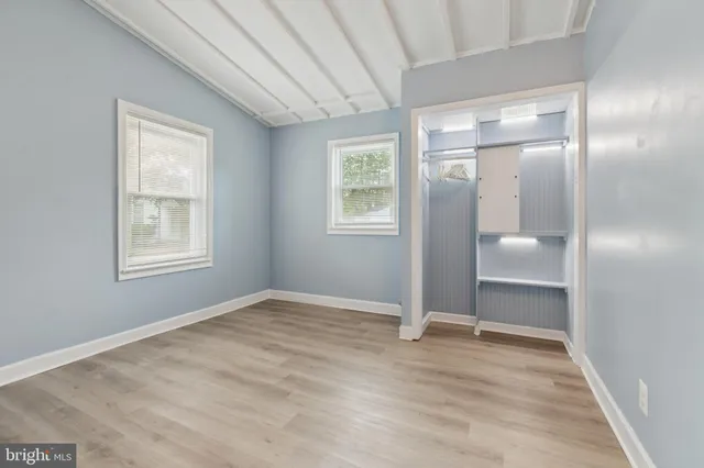 a view of a backyard with plants and a patio