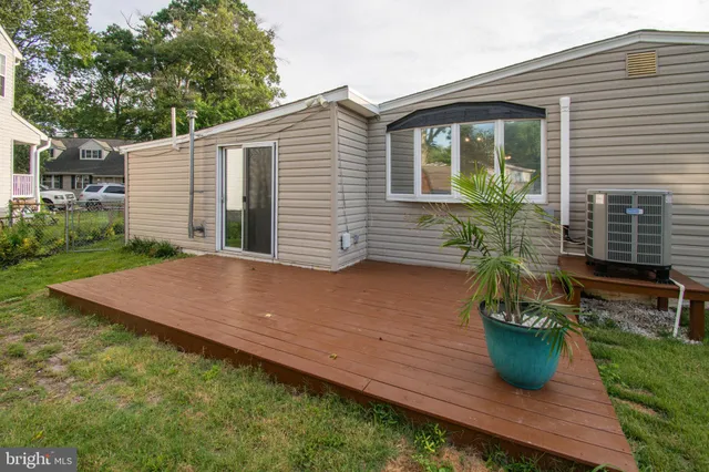 a house that has a tree in front of it
