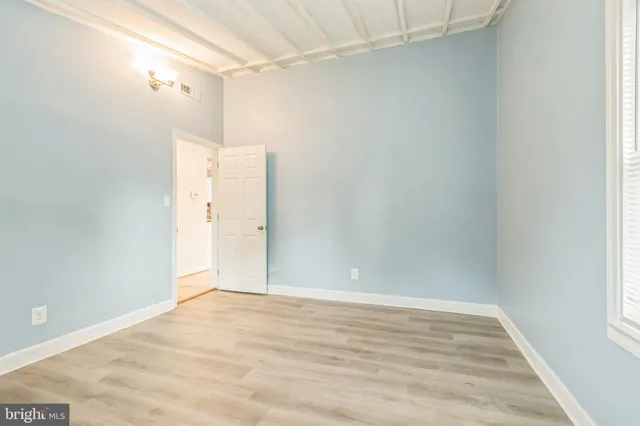 a kitchen with a sink a refrigerator and window