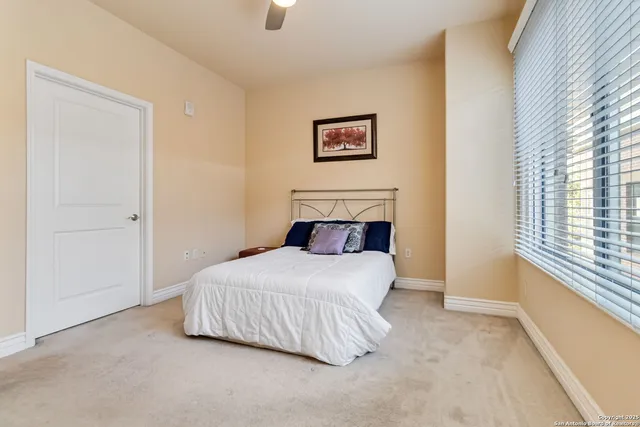 a bedroom with a bed and a view of bathroom