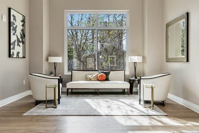 a view of a dining room with furniture and wooden floor