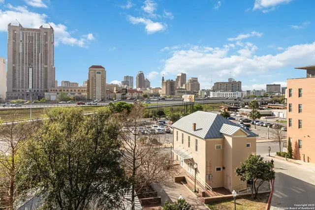 a view of a city with tall buildings