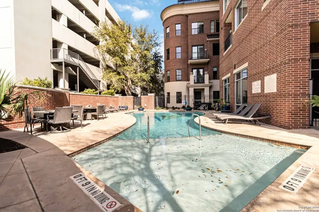 a view of a swimming pool with a patio
