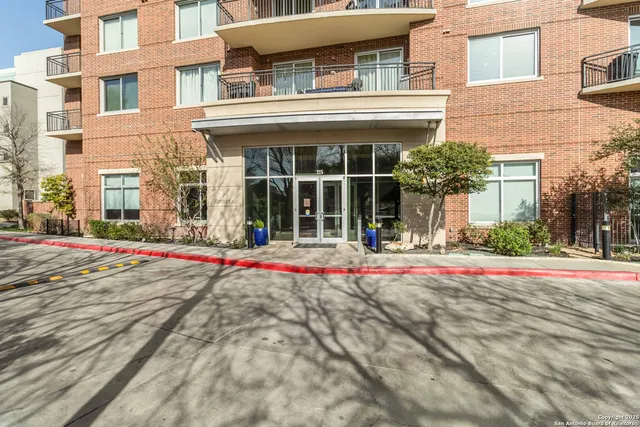a kitchen with stainless steel appliances granite countertop a refrigerator sink and cabinets