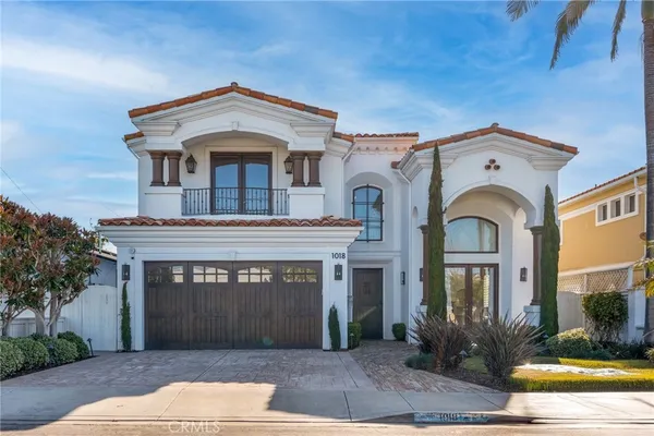 a front view of a house with yard