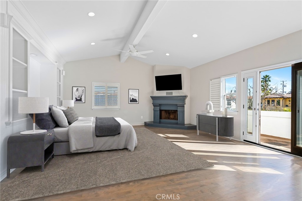 1018 11th Street Manhattan Beach, CA 90266 - Photo 13 of 29 a living room with furniture a fireplace and a flat screen tv