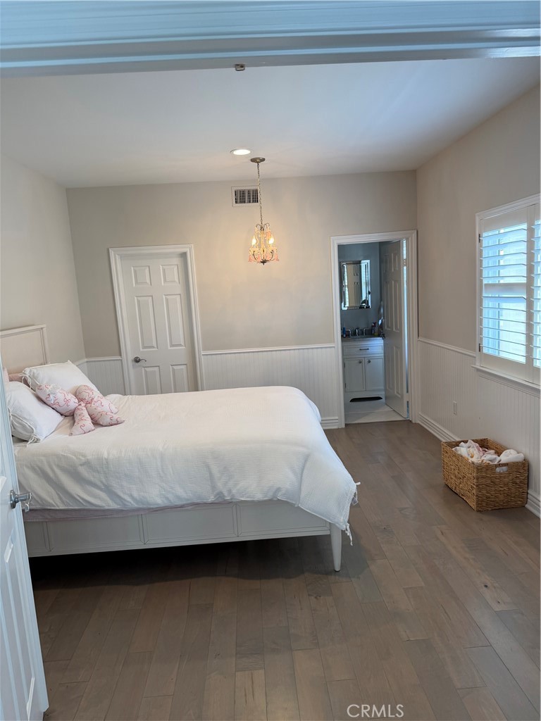 1018 11th Street Manhattan Beach, CA 90266 - Photo 16 of 29 a bedroom with a bed and window