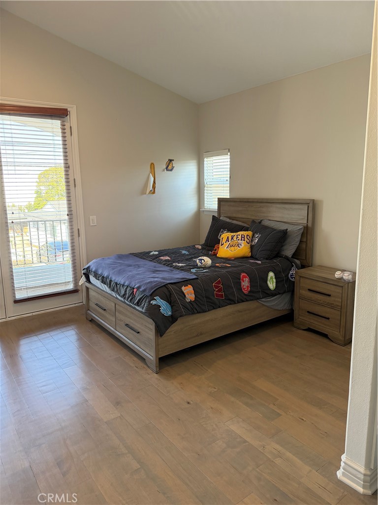 1018 11th Street Manhattan Beach, CA 90266 - Photo 18 of 29 a bedroom with a bed and a window