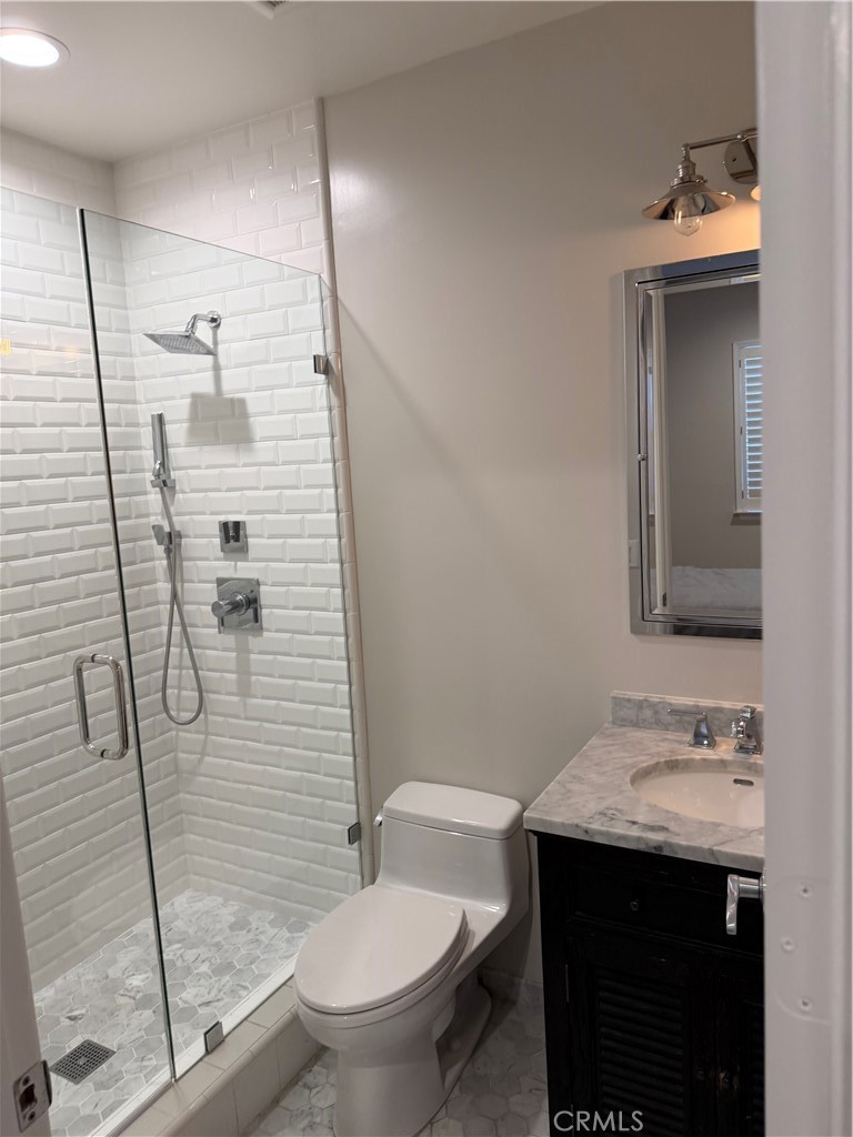 1018 11th Street Manhattan Beach, CA 90266 - Photo 19 of 29 a bathroom with a sink toilet and shower