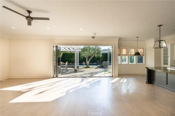 a view of a kitchen with a sink and a large window