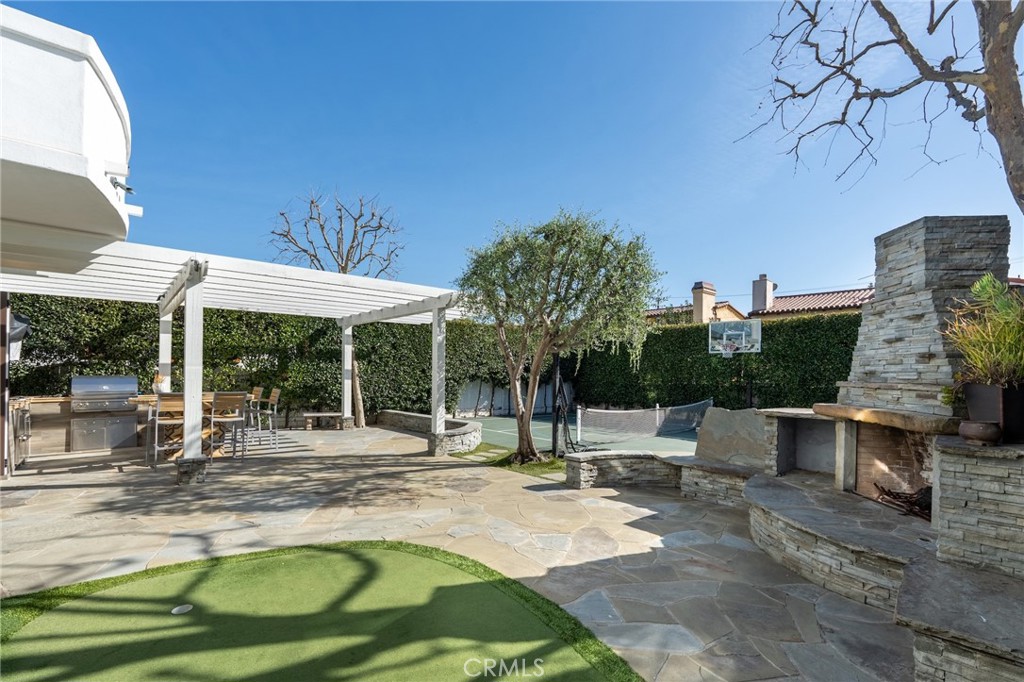 1018 11th Street Manhattan Beach, CA 90266 - Photo 26 of 29 a swimming pool with outdoor seating and yard