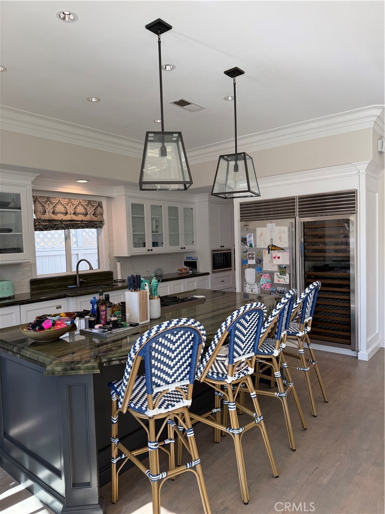 1018 11th Street Manhattan Beach, CA 90266 - Photo 4 of 29 a dining room with furniture and wooden floor