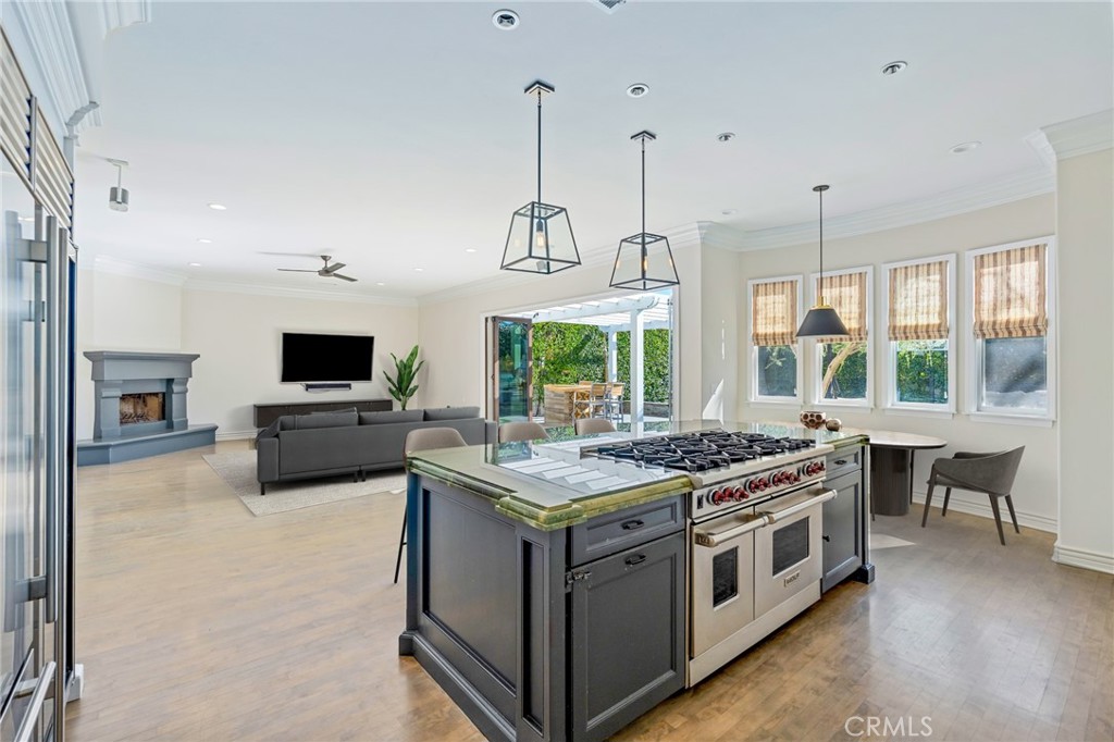 1018 11th Street Manhattan Beach, CA 90266 - Photo 6 of 29 a kitchen with a stove and a flat screen tv