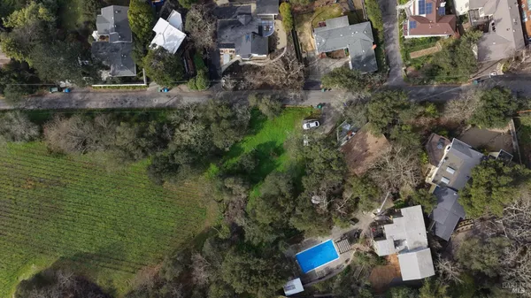 a aerial view of a house with a yard