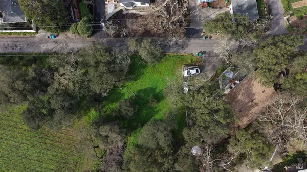 a aerial view of a house with a yard