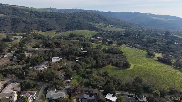 an aerial view of residential house and green space
