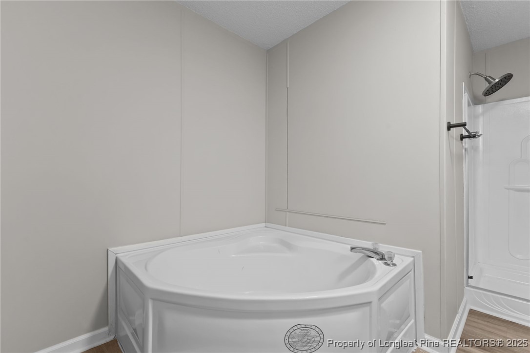 670 Bear Bay Road Lumberton, NC 28358 - Photo 15 of 25 a white bath tub sitting in a bathroom