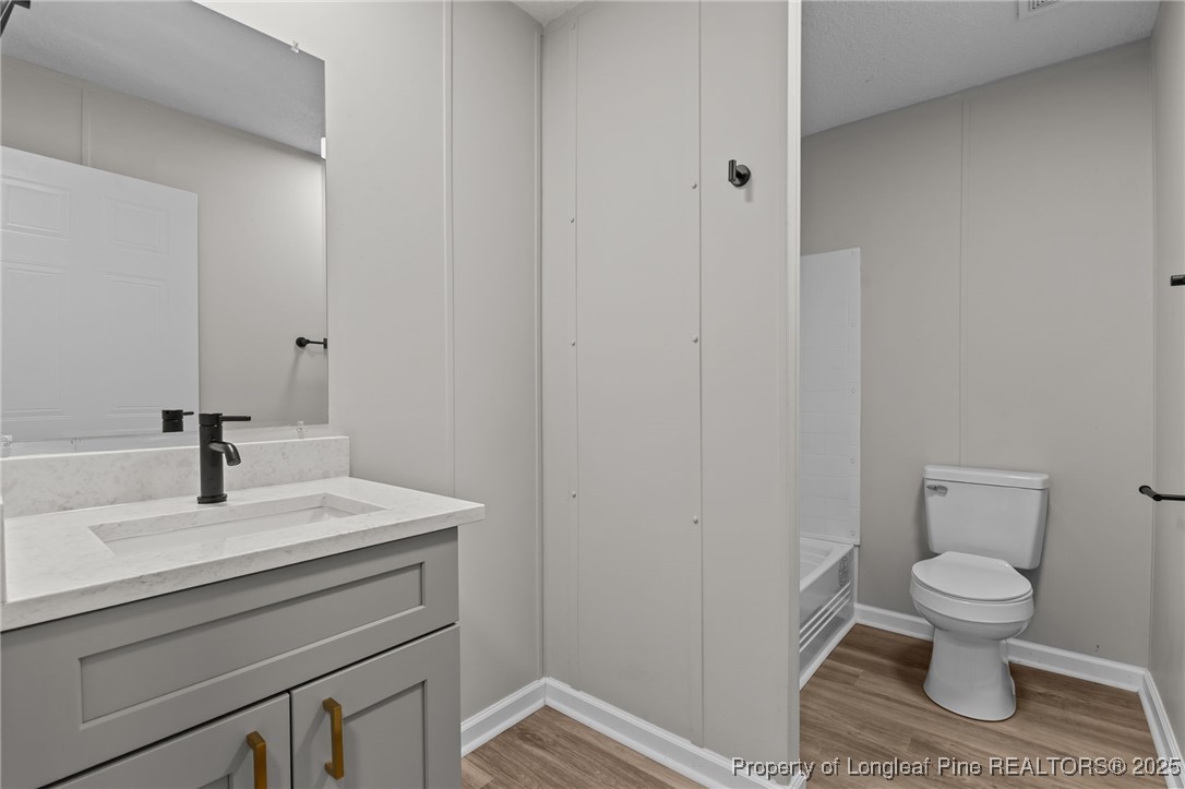 670 Bear Bay Road Lumberton, NC 28358 - Photo 17 of 25 a bathroom with a toilet sink and mirror