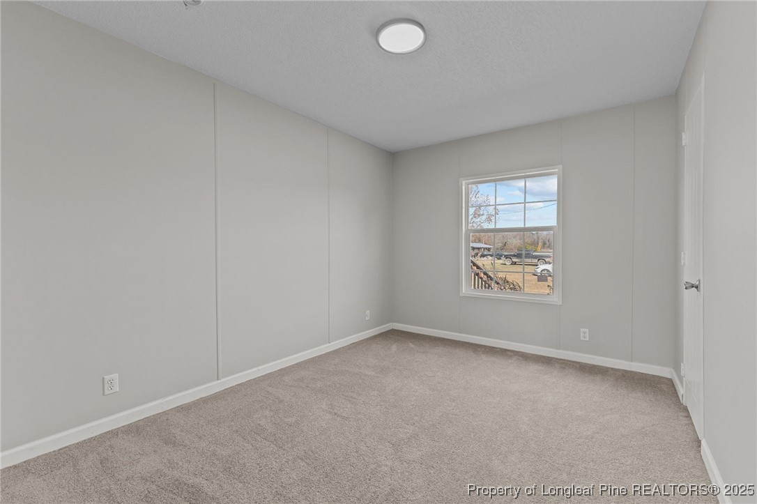 670 Bear Bay Road Lumberton, NC 28358 - Photo 20 of 25 an empty room with windows