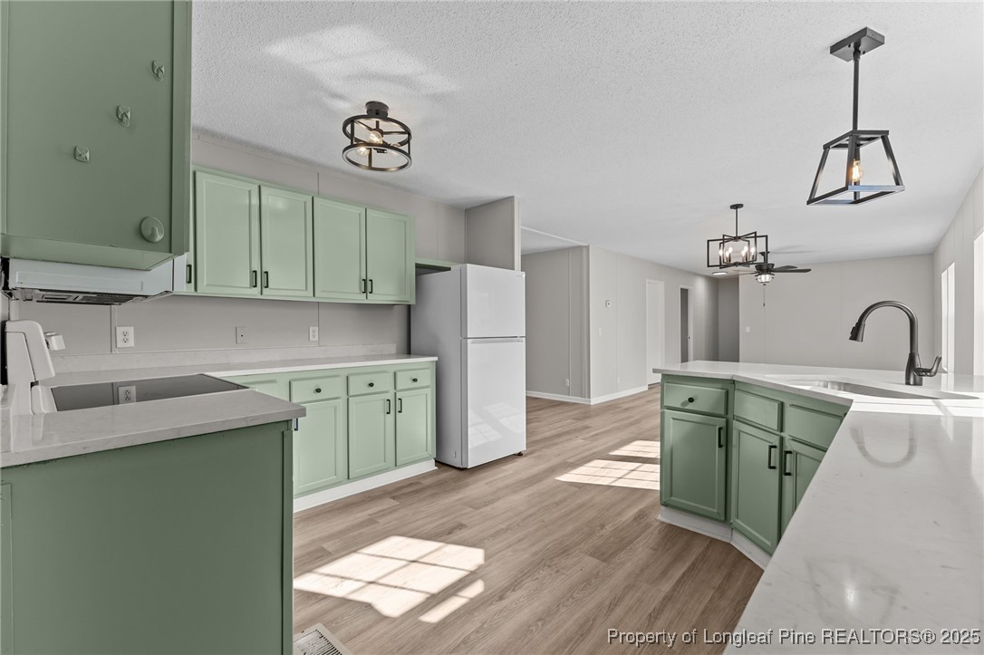 670 Bear Bay Road Lumberton, NC 28358 - Photo 4 of 25 a kitchen with a sink cabinets and window