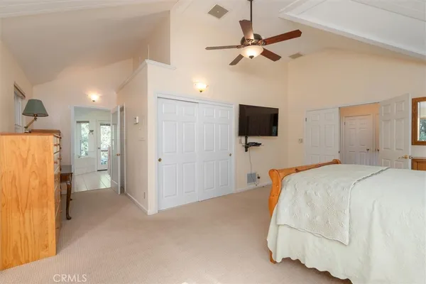 a bedroom with bed and a window