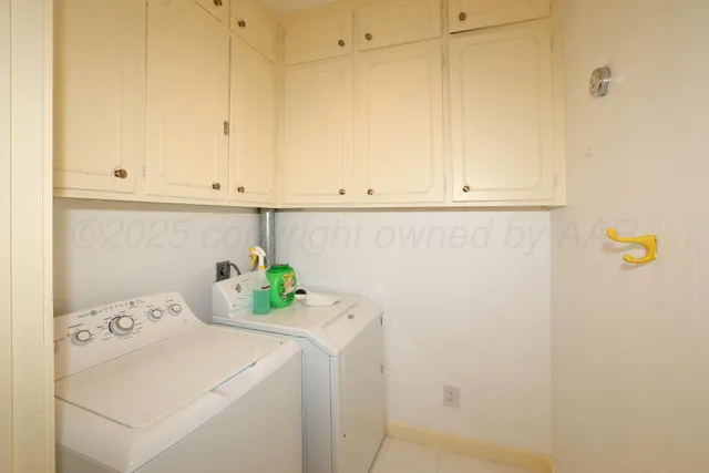 a view of kitchen with white cabinets