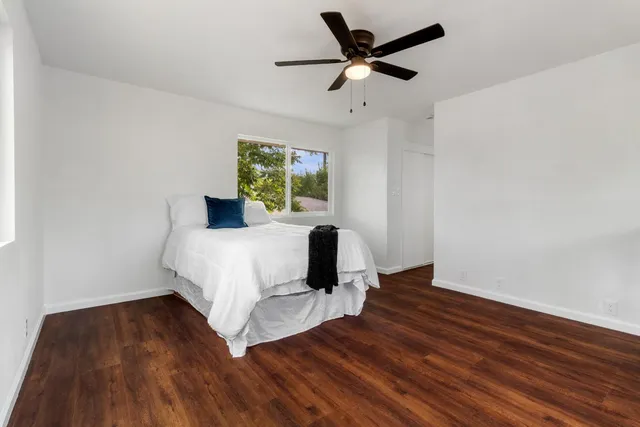 a bed room with a bed and a window