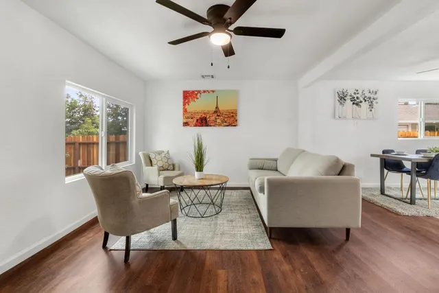 a living room with furniture and a window