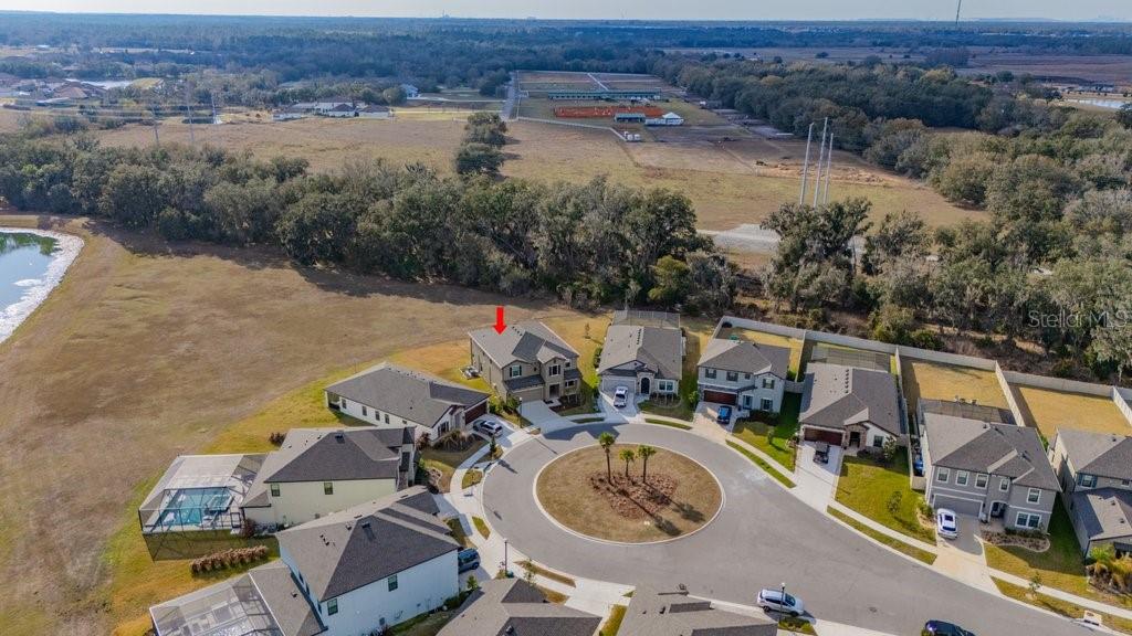 14604 Horse Trot Road Lithia, FL 33547 - Photo 52 of 62 an aerial view of a house with outdoor space and lake view