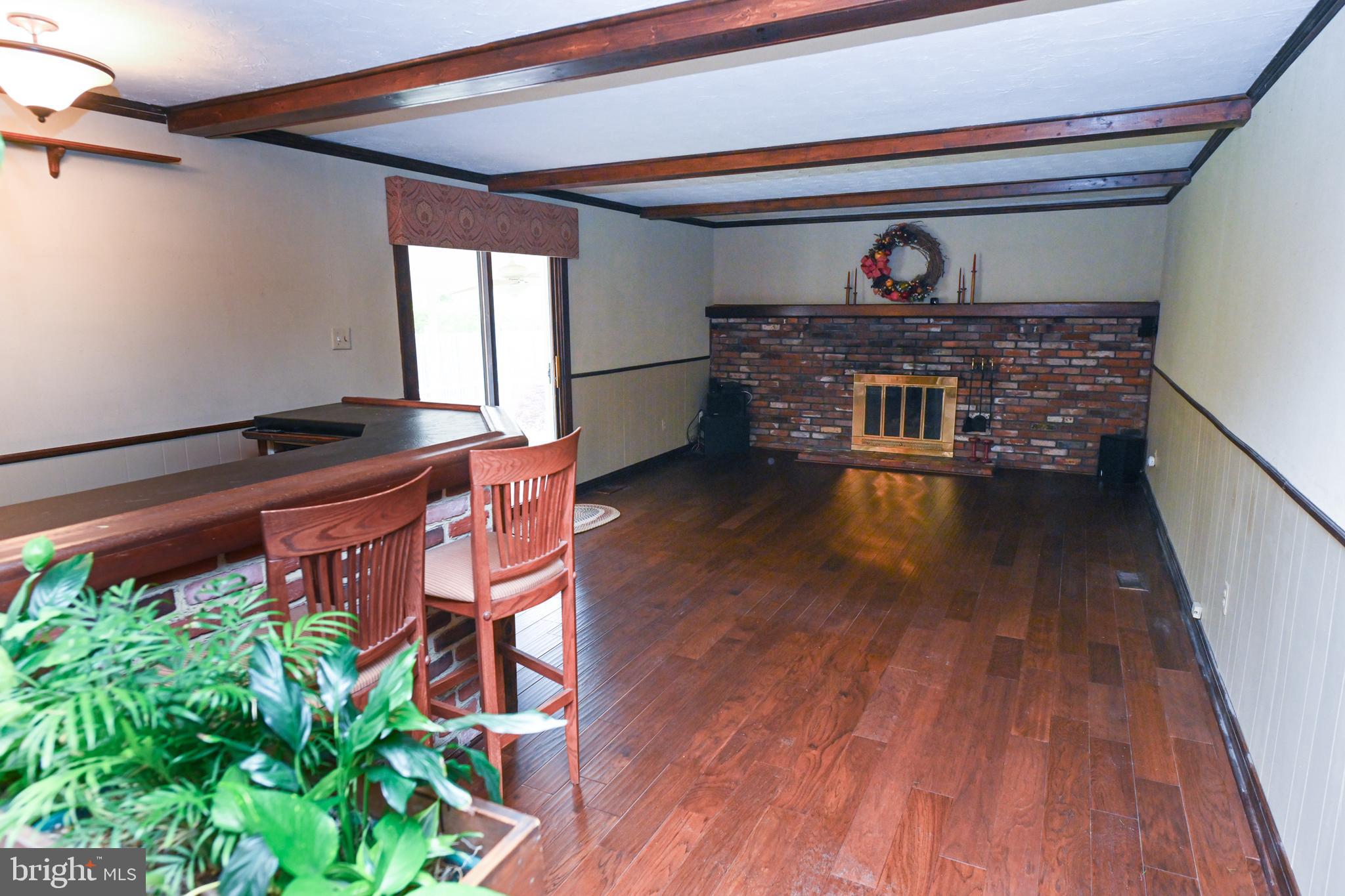 1713 Red Oak Road Williamstown, NJ 08094 - Photo 20 of 76 a living room with furniture and a fireplace