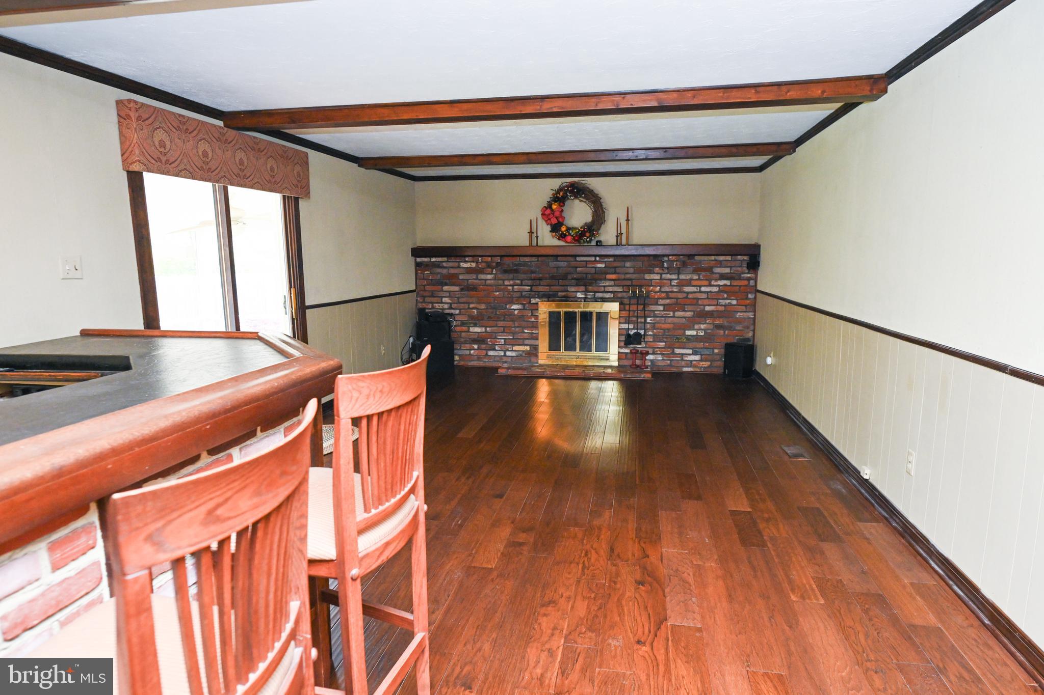 1713 Red Oak Road Williamstown, NJ 08094 - Photo 24 of 76 a view of a hallway with wooden floor and furniture
