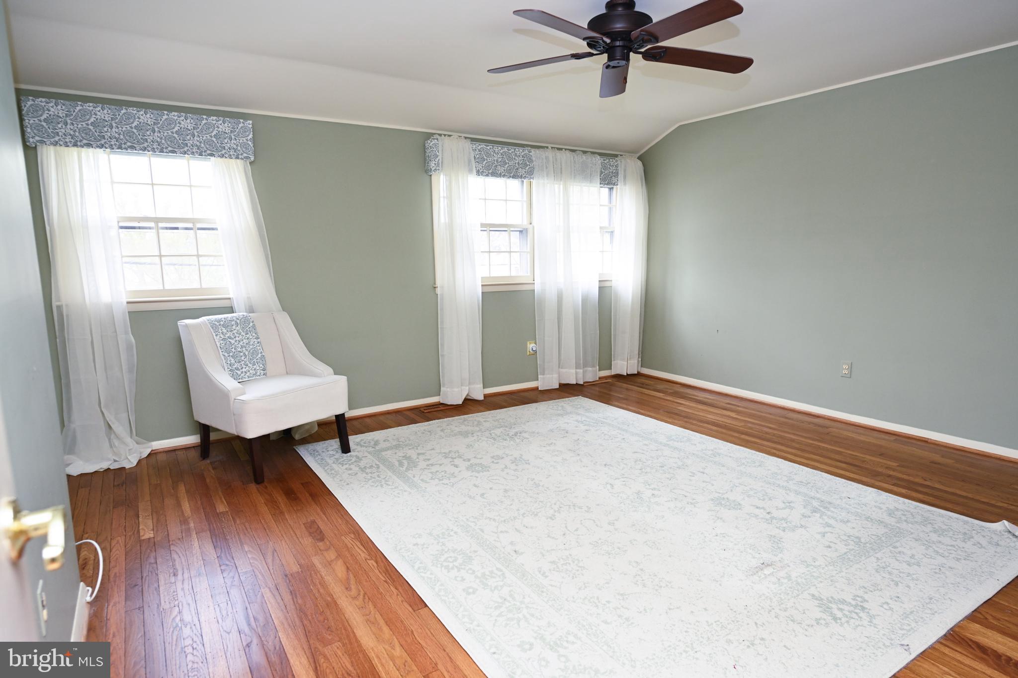 1713 Red Oak Road Williamstown, NJ 08094 - Photo 39 of 76 a bedroom with a bed and a chandelier